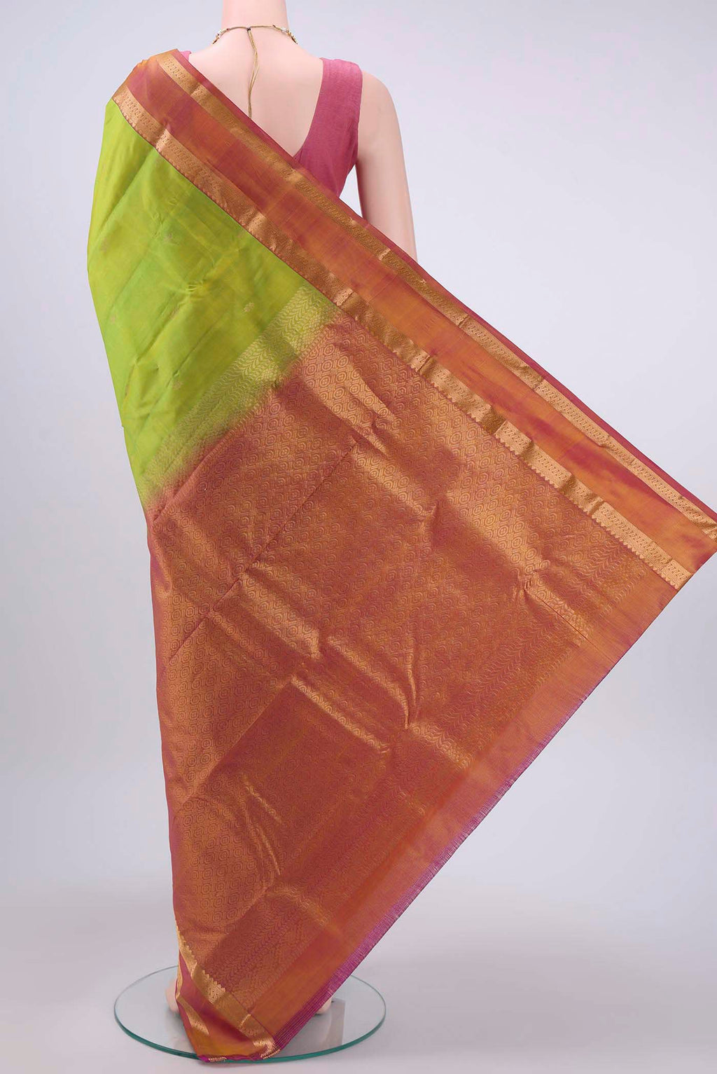 Flat view of Parrot Green Nangavalli Silk [ Salem ] Saree with Zari Butta on the body and Zari Border