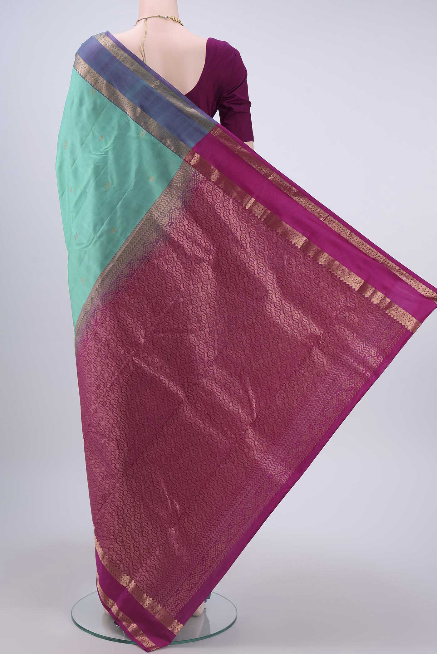 Flat view of Turquoise Nangavalli Silk [ Salem ] Saree with Zari Butta on the body and Zari Border