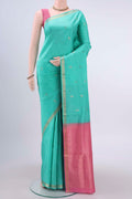 Mint Green Soft Silk Saree with Plain Body and Zari Border displayed on a mannequin