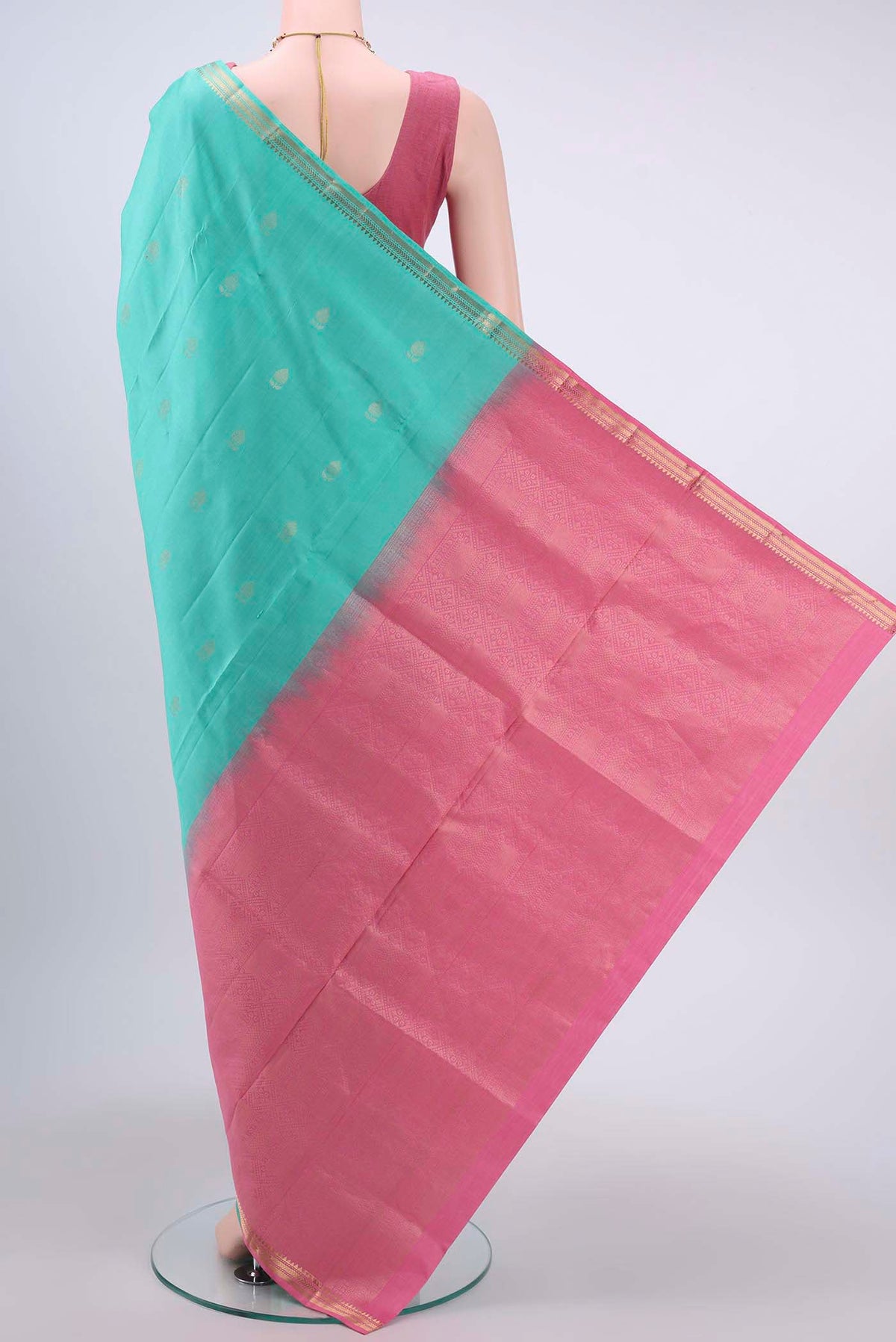 Flat view of Mint Green Soft Silk Saree with Plain Body and Zari Border