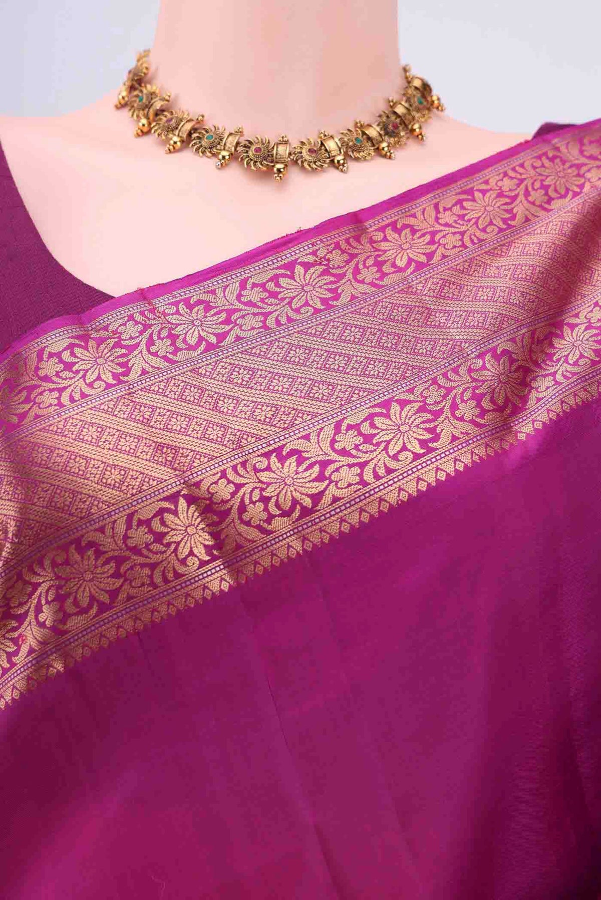 Border image of Rani Pink Soft Silk Saree with Zari Butta on the body and Zari Border