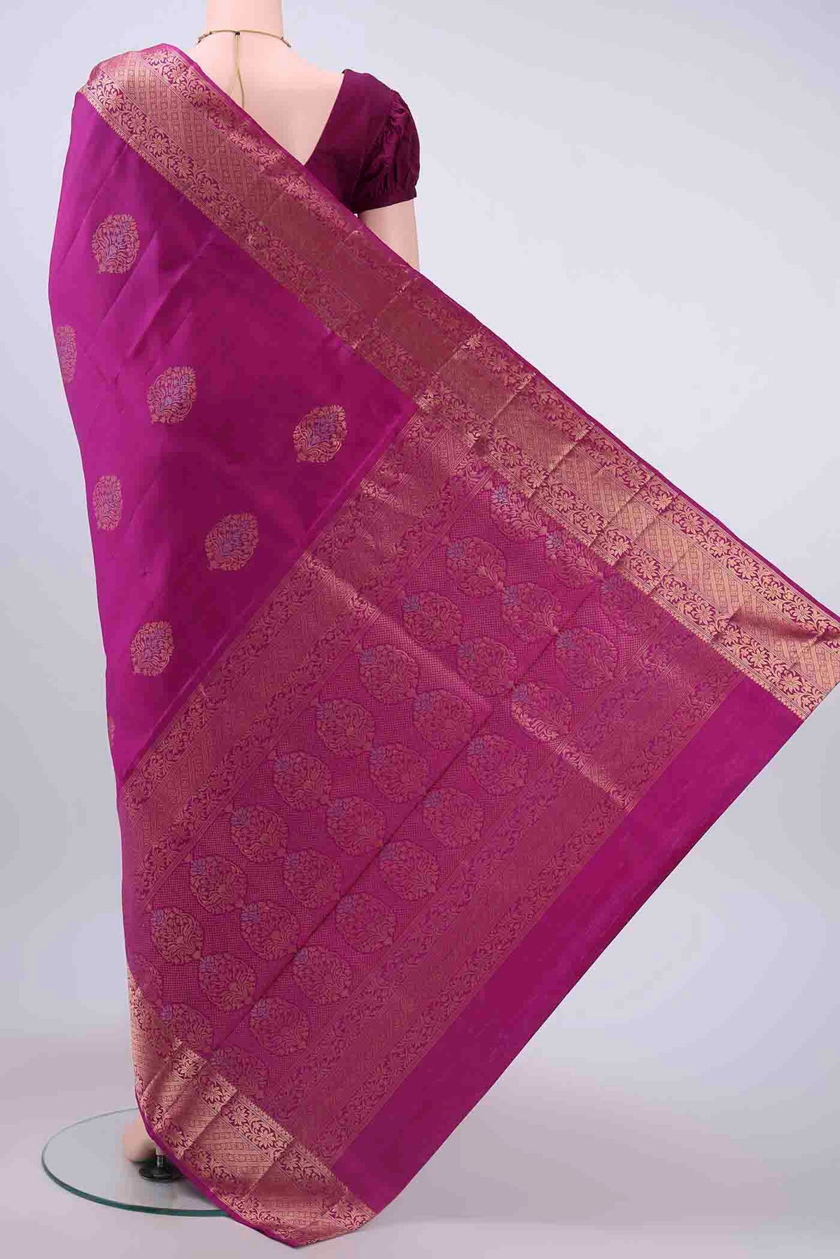 Flat view of Rani Pink Soft Silk Saree with Zari Butta on the body and Zari Border