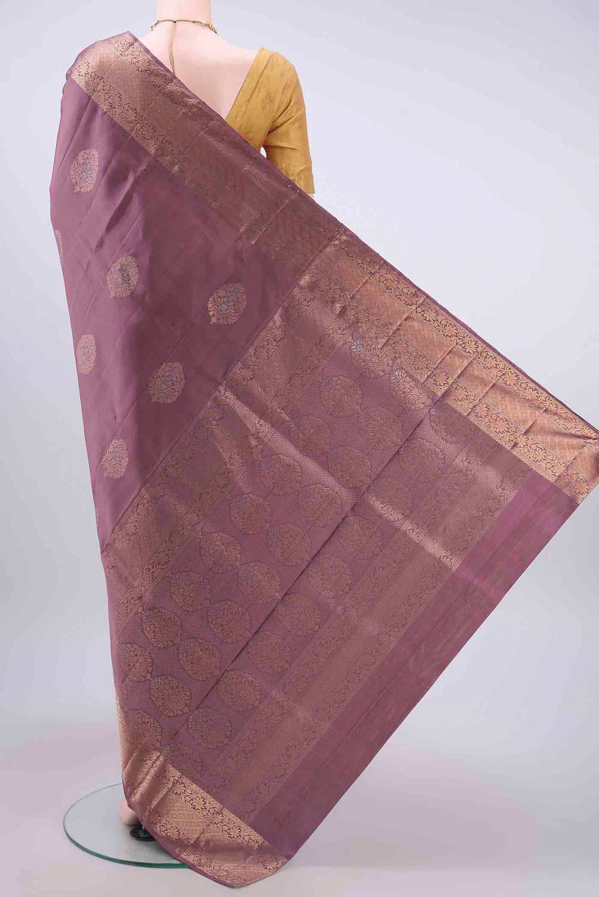 Flat view of Coral Soft Silk Saree with Zari Butta on the body and Zari Border