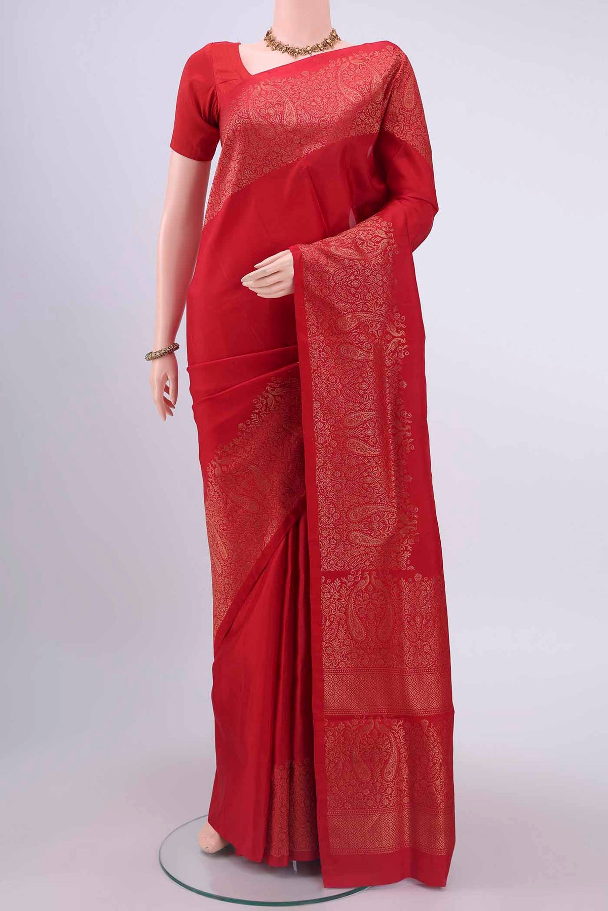 Red Soft Silk Saree with Plain Body and Zari Border displayed on a mannequin