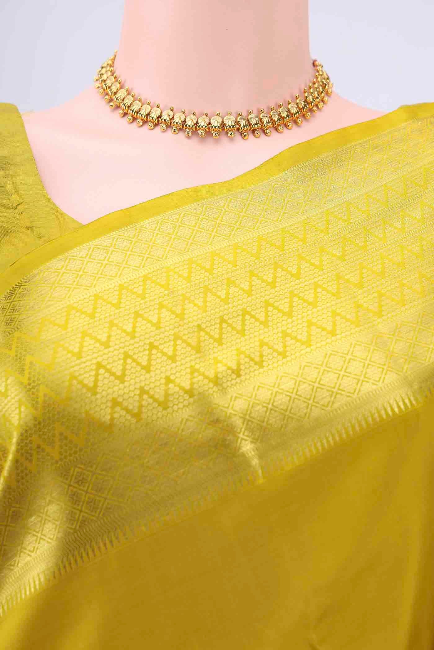 Border image of Acid Green Kanchipuram Saree with Zari Butta on the body and Zari Border