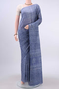 Blue Tussar Silk Saree with Printed design on the body and Printed Border displayed on a mannequin