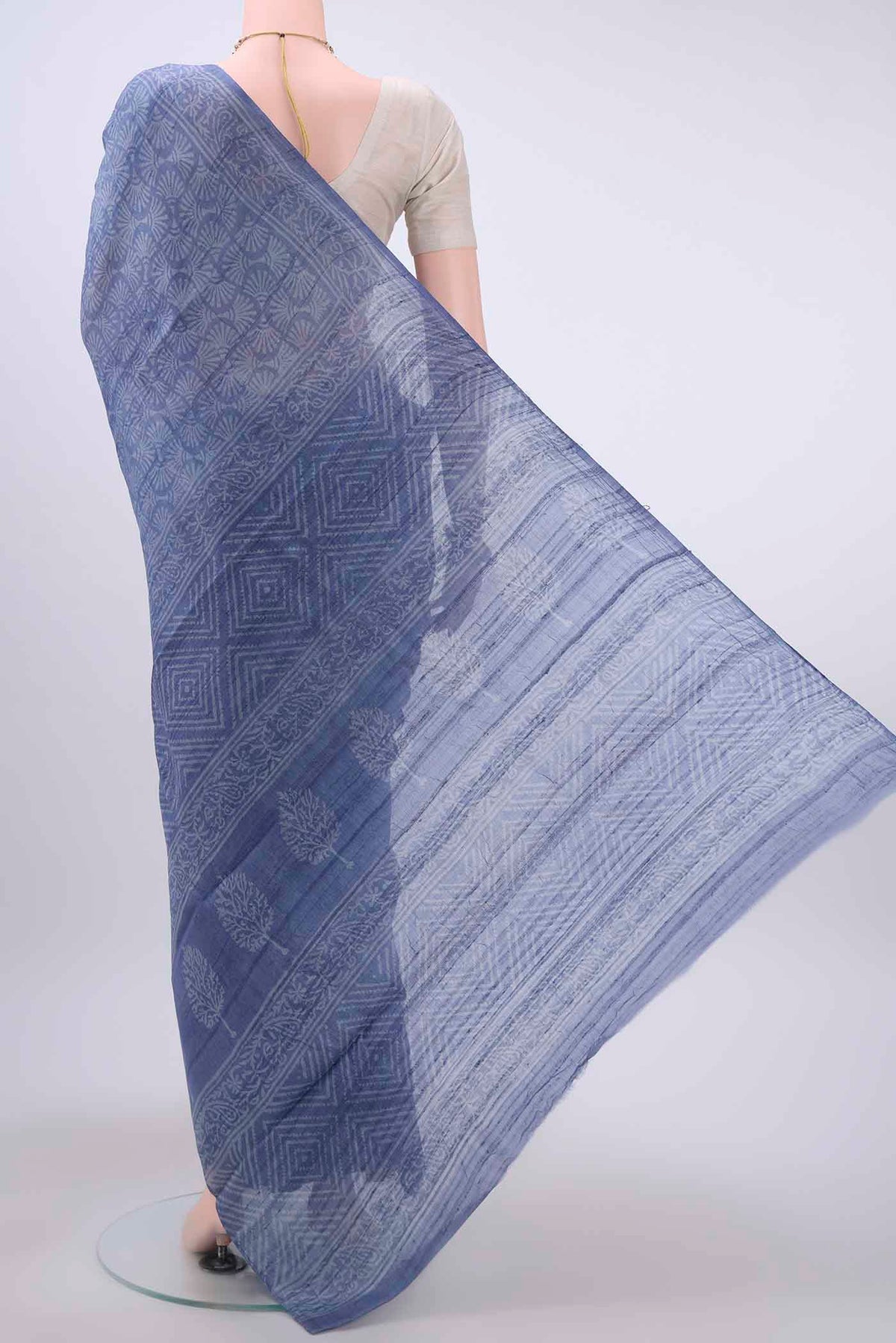 Flat view of Blue Tussar Silk Saree with Printed design on the body and Printed Border