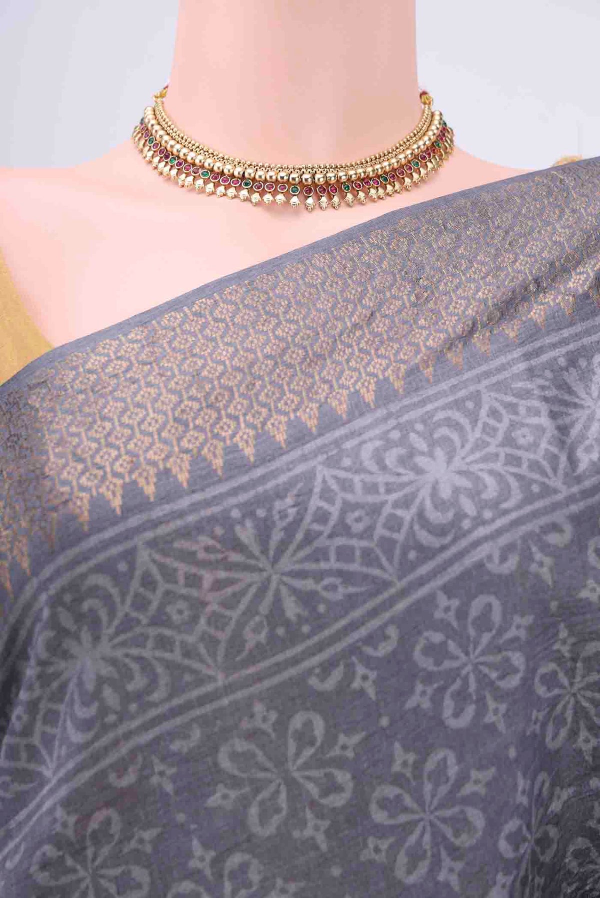 Border image of Grey Tussar Silk Saree with Printed design on the body and Zari Border