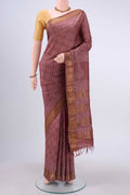 Coral Tussar Silk Saree with Printed design on the body and Zari Border displayed on a mannequin