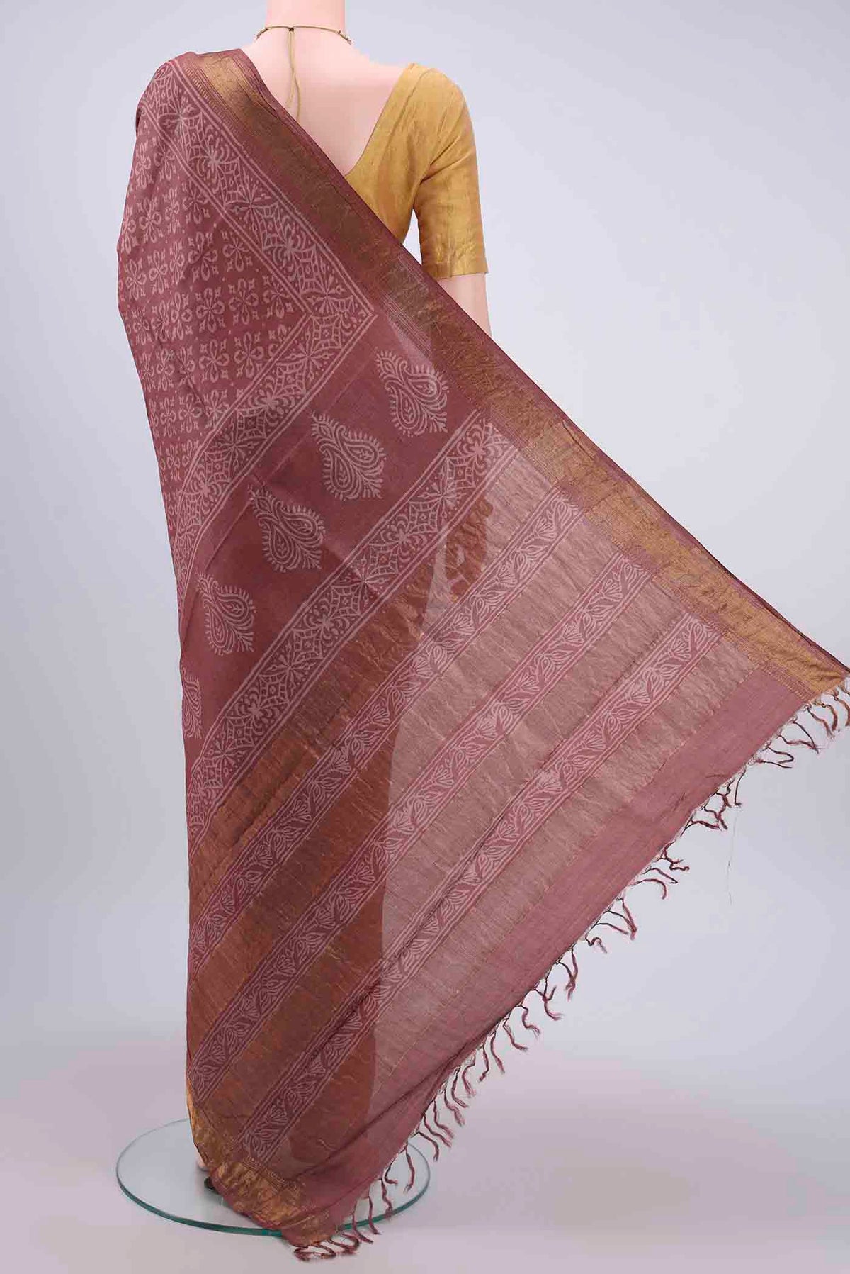 Flat view of Coral Tussar Silk Saree with Printed design on the body and Zari Border