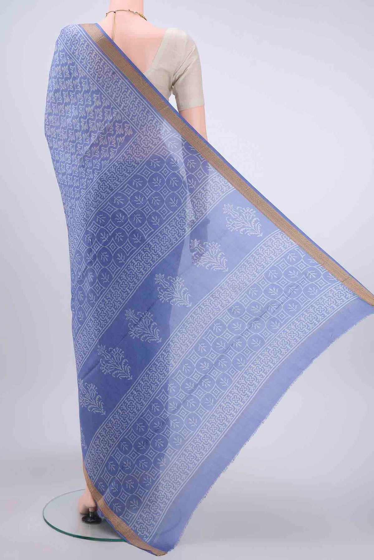 Flat view of Light Blue Printed Silk Saree with Printed design on the body and Zari Border