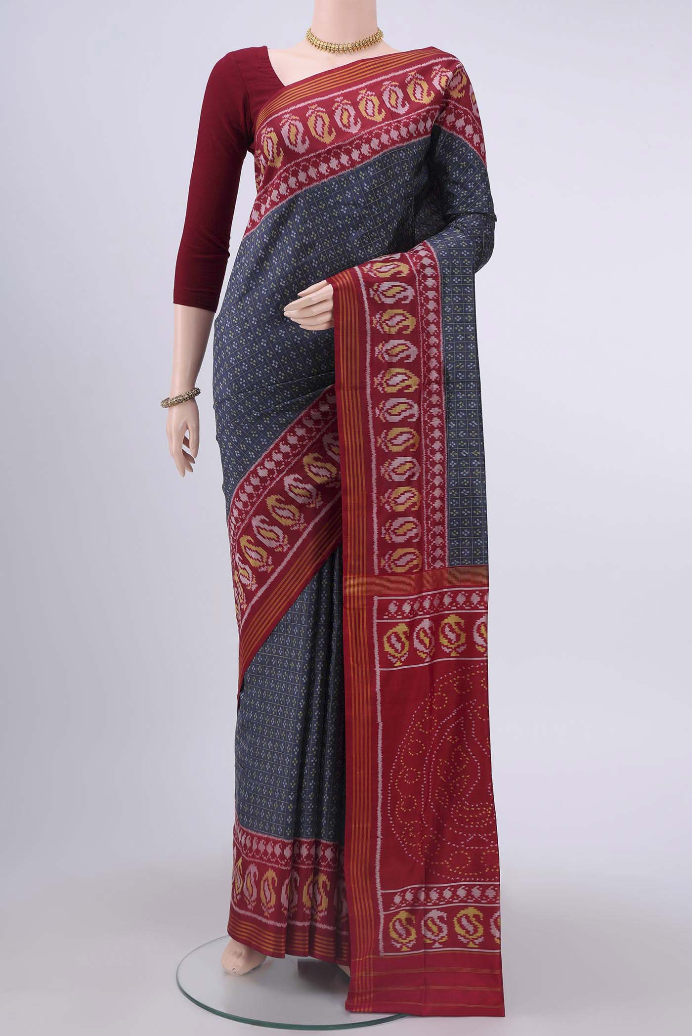 Blue Grey Dual Tone Rajkot Patola Silk Saree with Ikat design on the body and Zari Border displayed on a mannequin