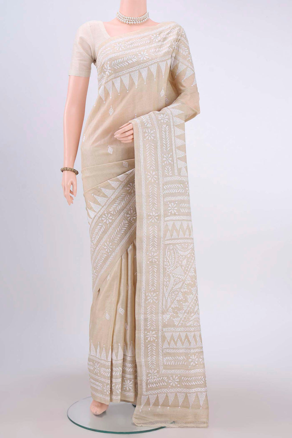 Beige Kantha Silk Saree with Kantha Work on the body and Thread Border displayed on a mannequin