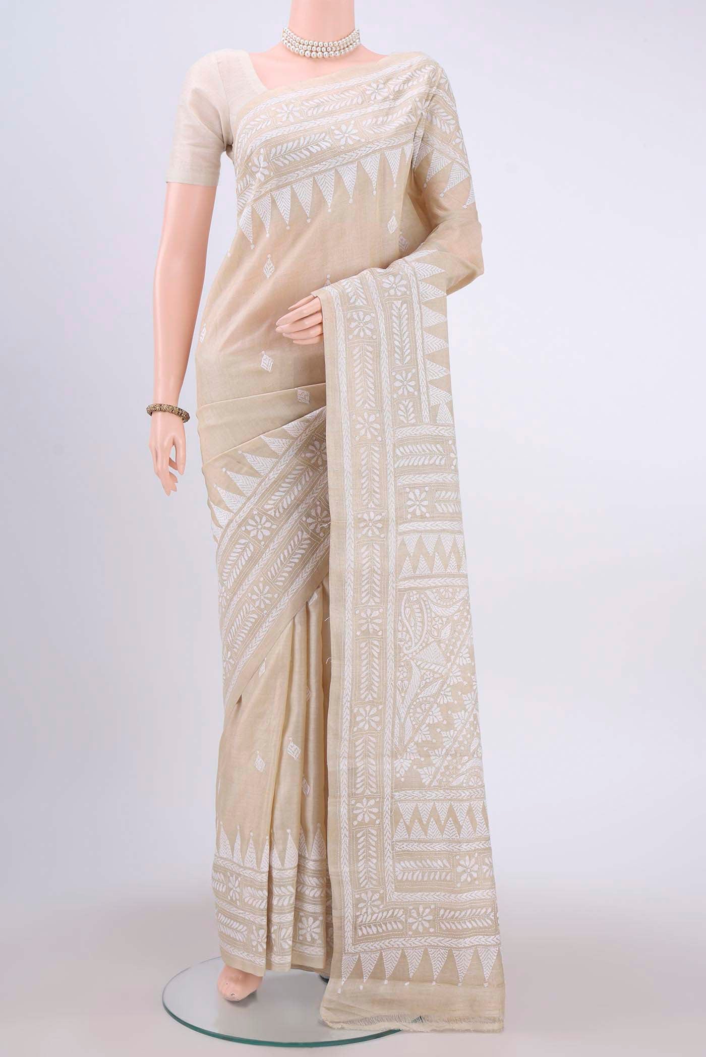 Beige Kantha Silk Saree with Kantha Work on the body and Thread Border displayed on a mannequin