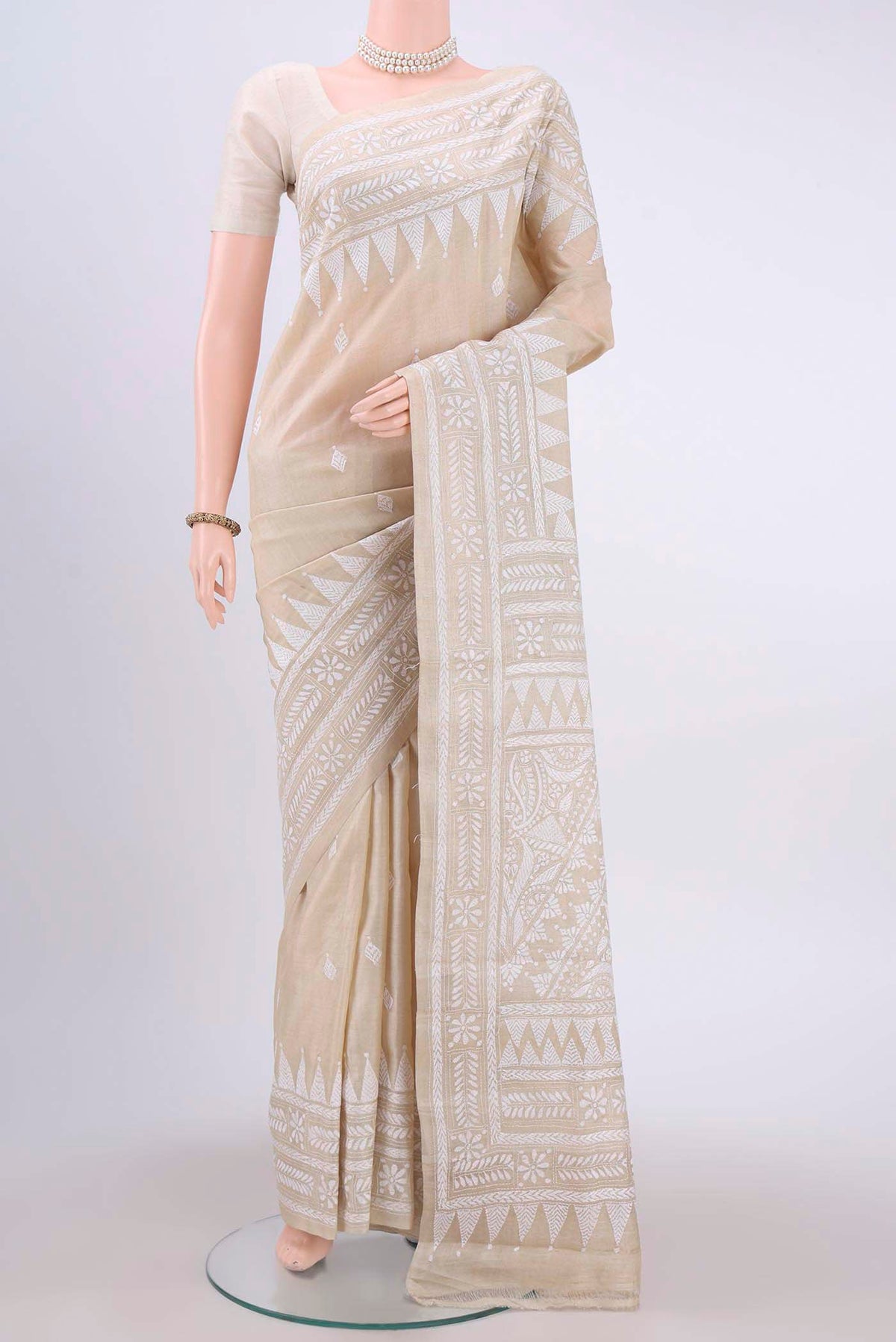 Beige Kantha Silk Saree with Kantha Work on the body and Thread Border displayed on a mannequin