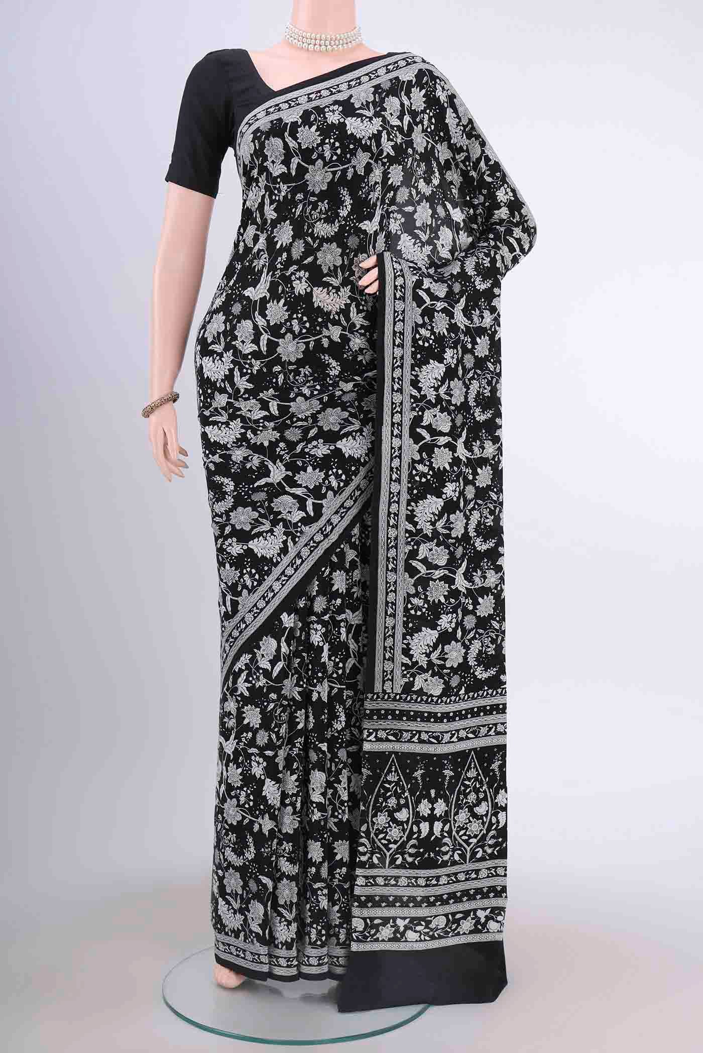 Black Mysore Crepe Saree with Floral Print on the body and Printed Border displayed on a mannequin