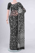 Black Mysore Crepe Saree with Floral Print on the body and Zari Border displayed on a mannequin