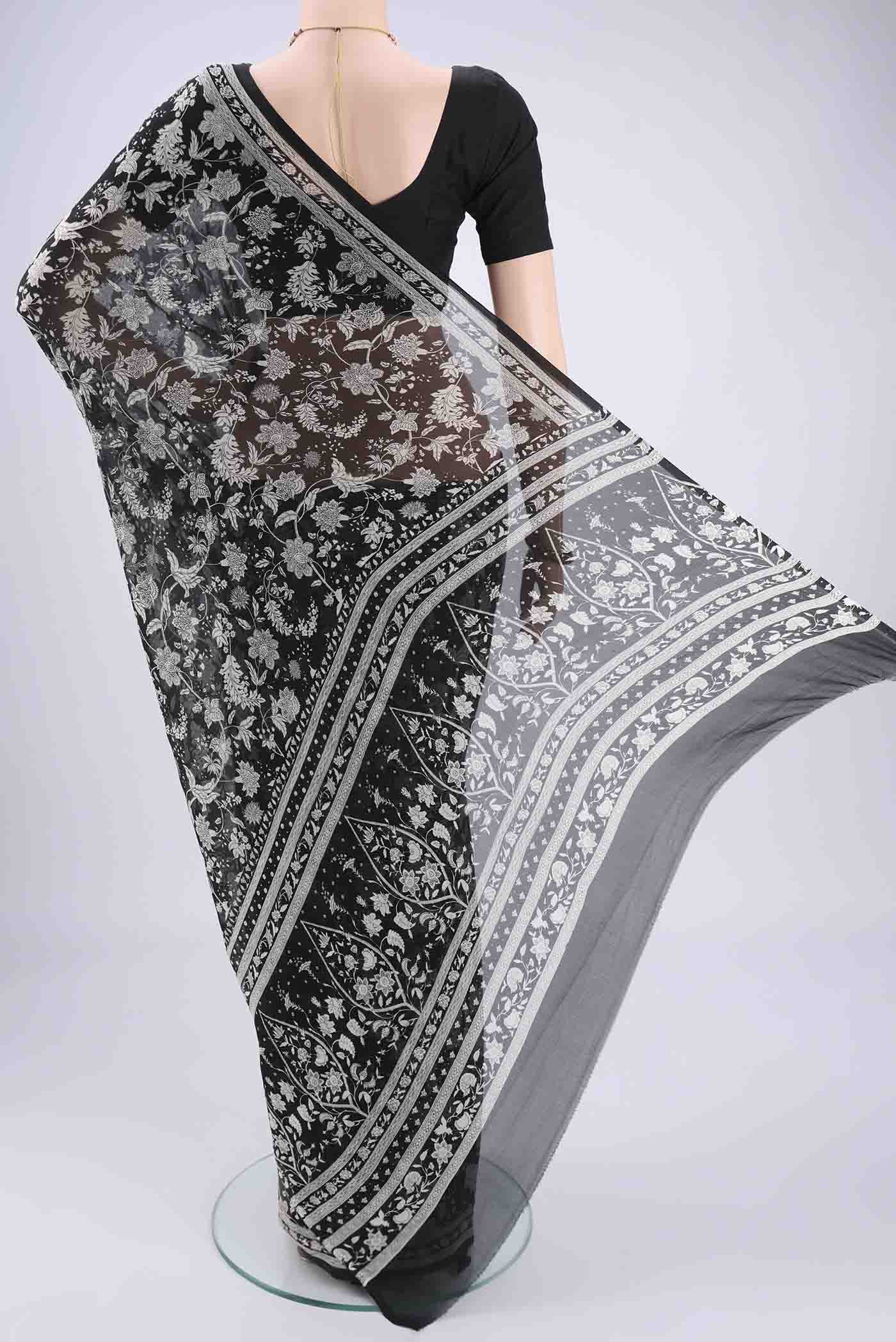 Flat view of Black Mysore Chiffon Saree with Floral Print on the body and Zari Border. 