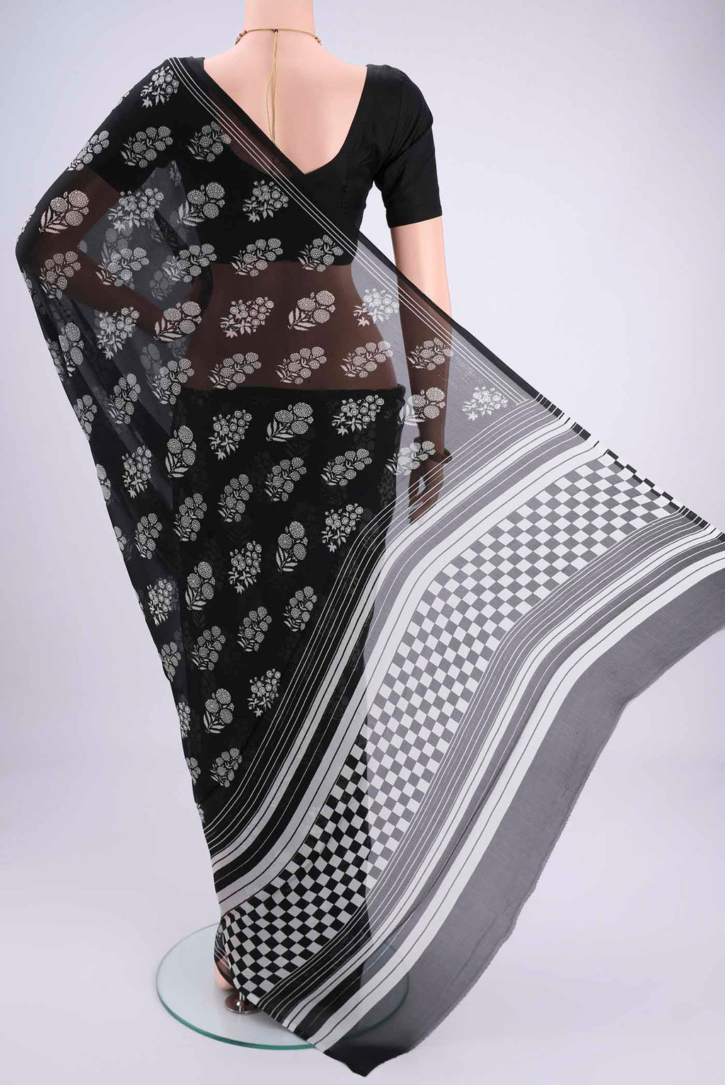 Flat view of Black Mysore Chiffon Saree with Floral Print on the body and Plain Border. 