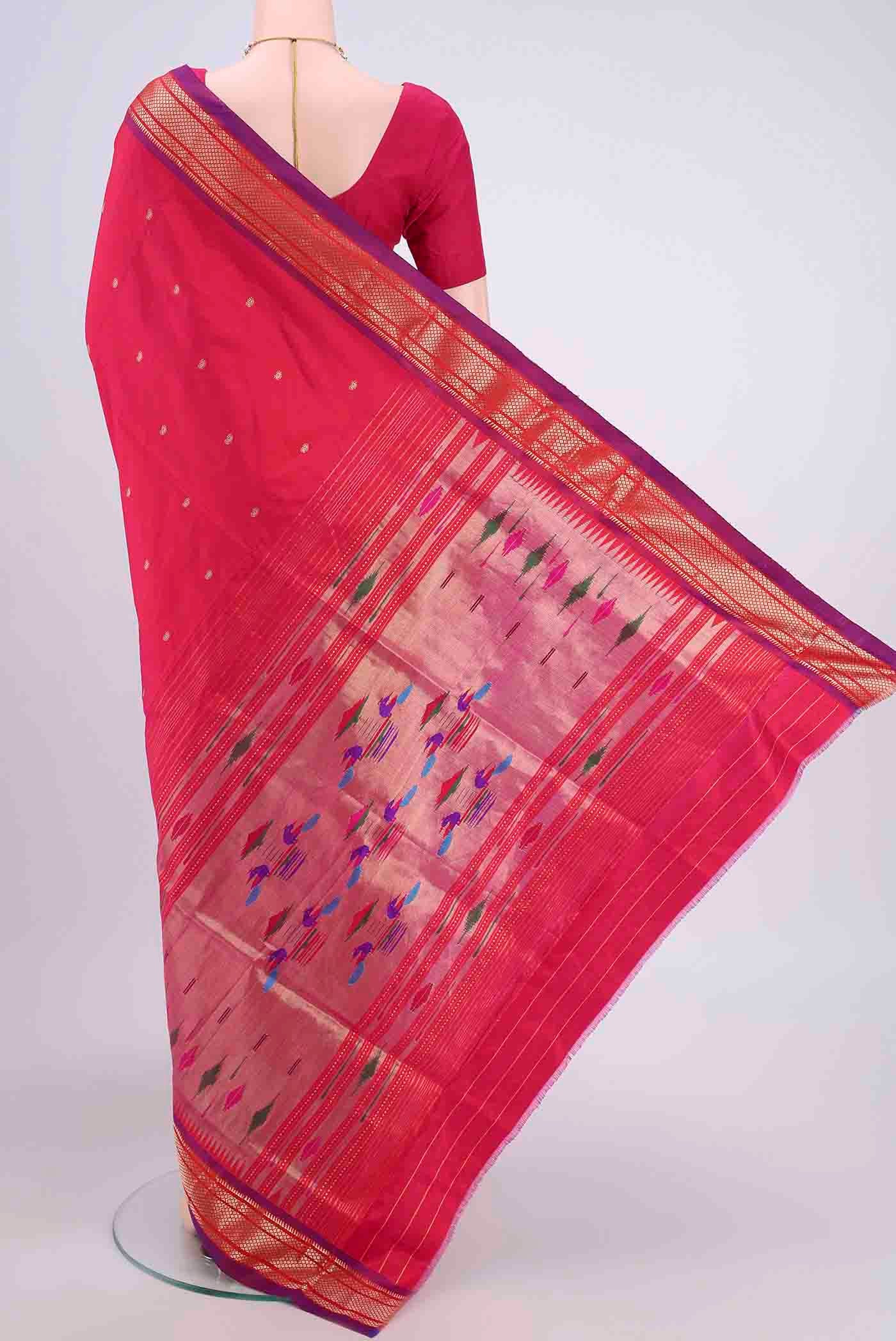 Flat view of Dark Pink Paithani Silk Saree with Zari Butta on the body and Zari Border. 