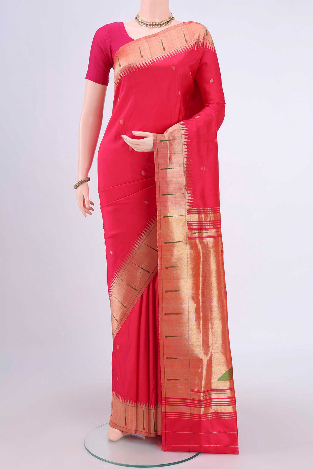 Dark Pink Paithani Silk Saree with Zari Butta on the body and Zari Border.  displayed on a mannequin