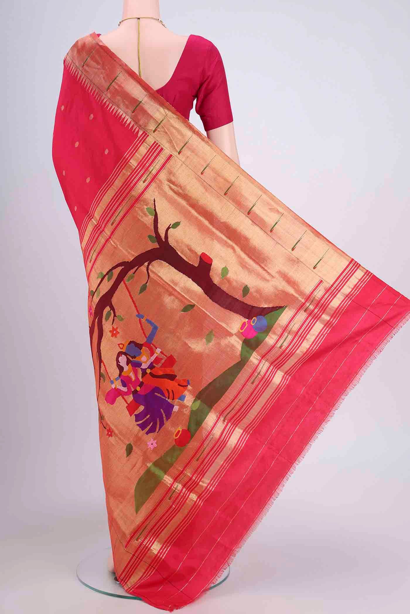 Flat view of Dark Pink Paithani Silk Saree with Zari Butta on the body and Zari Border. 