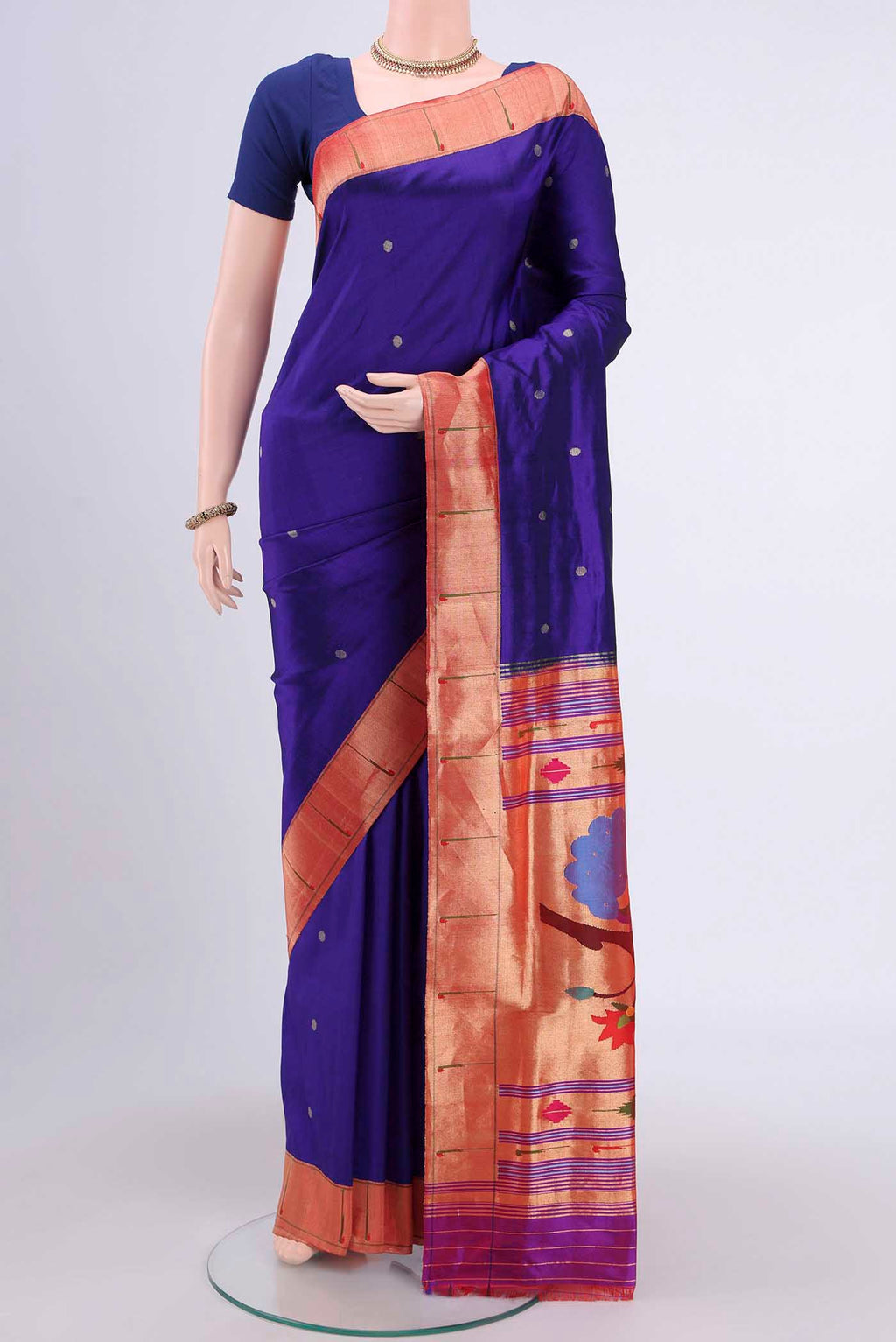 Purple Paithani Silk Saree with Zari Butta on the body and Zari Border.  displayed on a mannequin