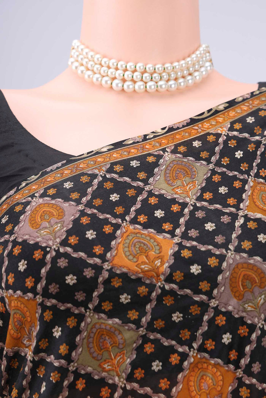 Border image of Black Printed Silk Saree with Floral Print on the body and Printed Border. 