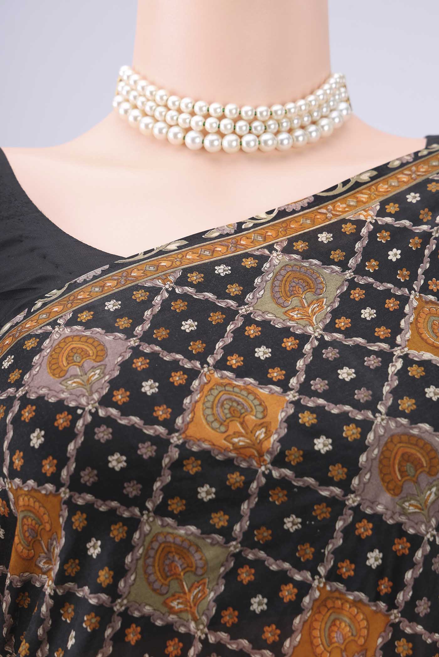 Border image of Black Printed Silk Saree with Floral Print on the body and Printed Border. 