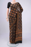 Black Printed Silk Saree with Floral Print on the body and Printed Border.  displayed on a mannequin