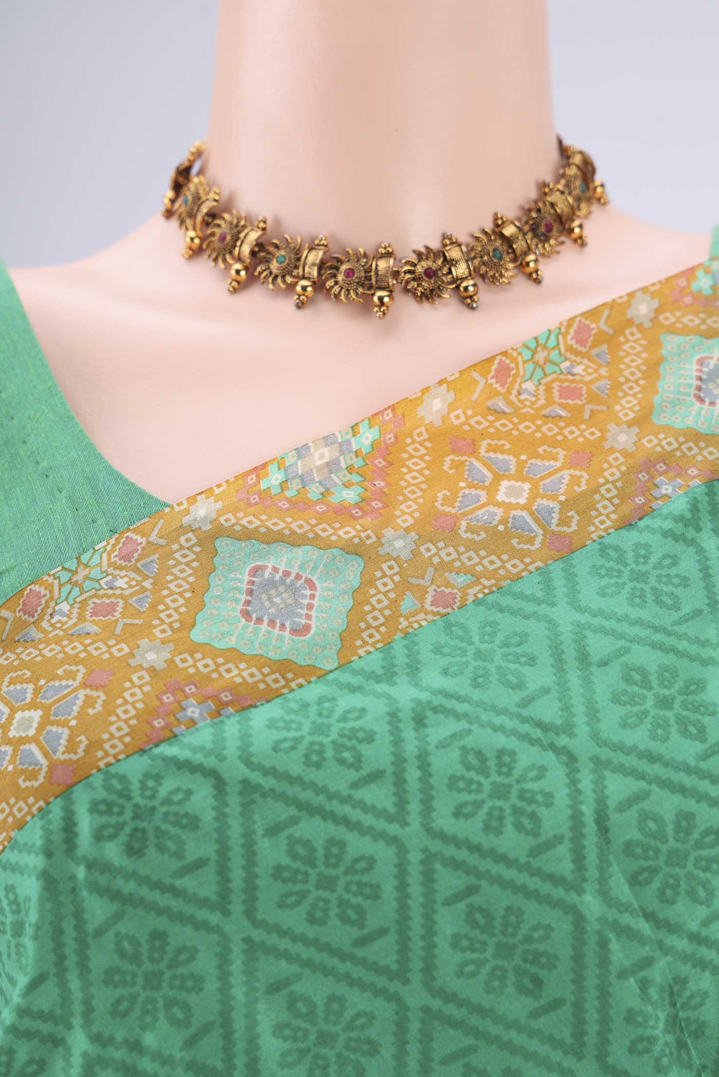 Border image of Green Printed Silk Saree with Floral Print on the body and Printed Border. 
