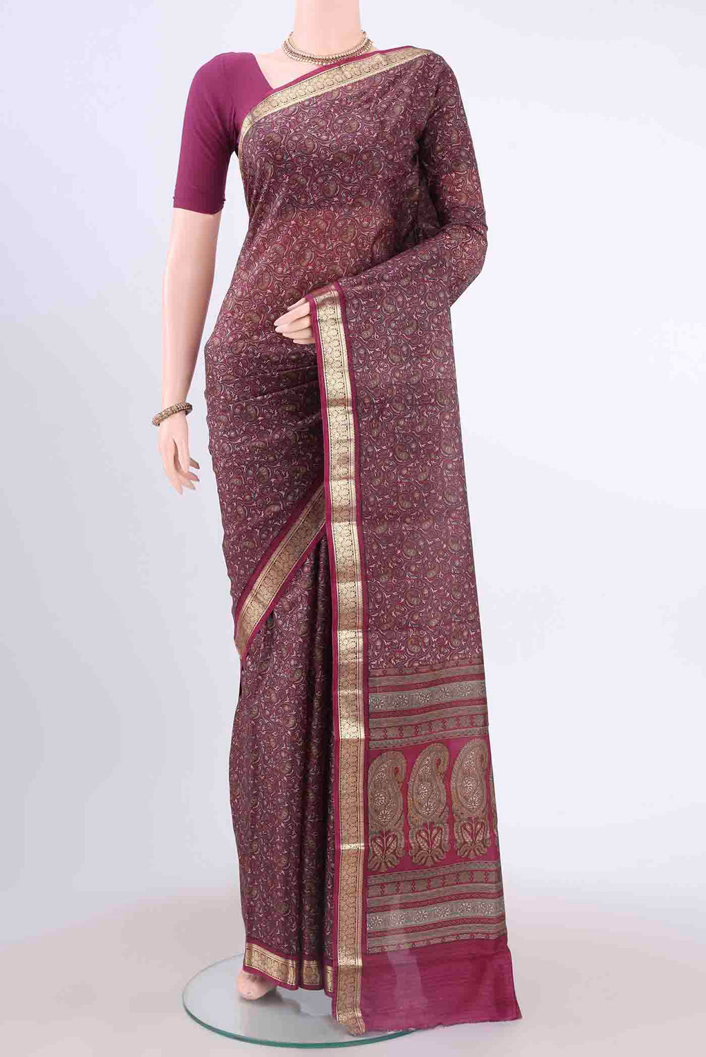 Magenta Printed Silk Saree with Floral Print on the body and Zari Border displayed on a mannequin