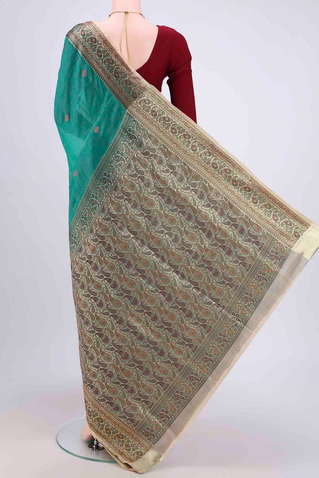 Flat view of Sea Green Banarasi Tussar Silk Saree with Zari Butta on the body and Zari Border. 
