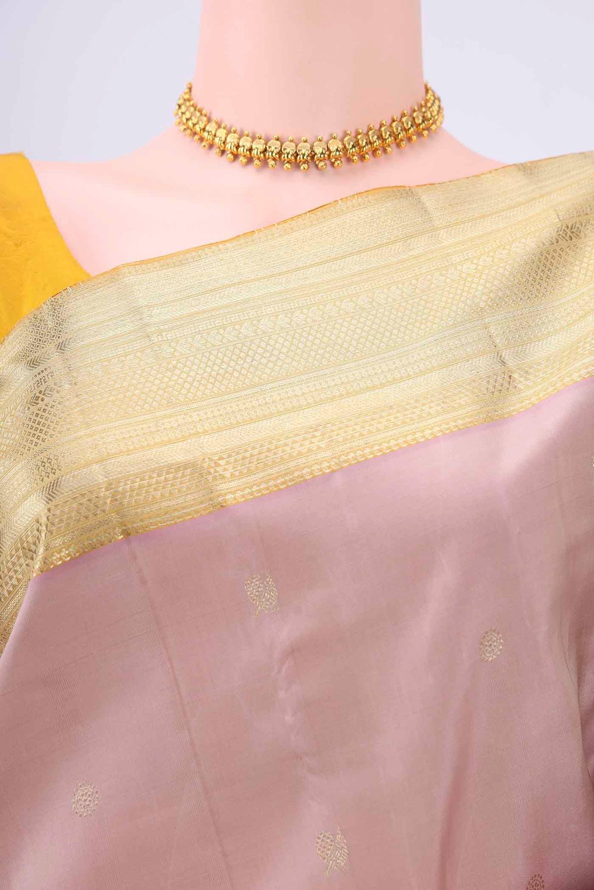 Border image of Rose Gold Kanchipuram Saree with Zari Butta on the body and Zari Border