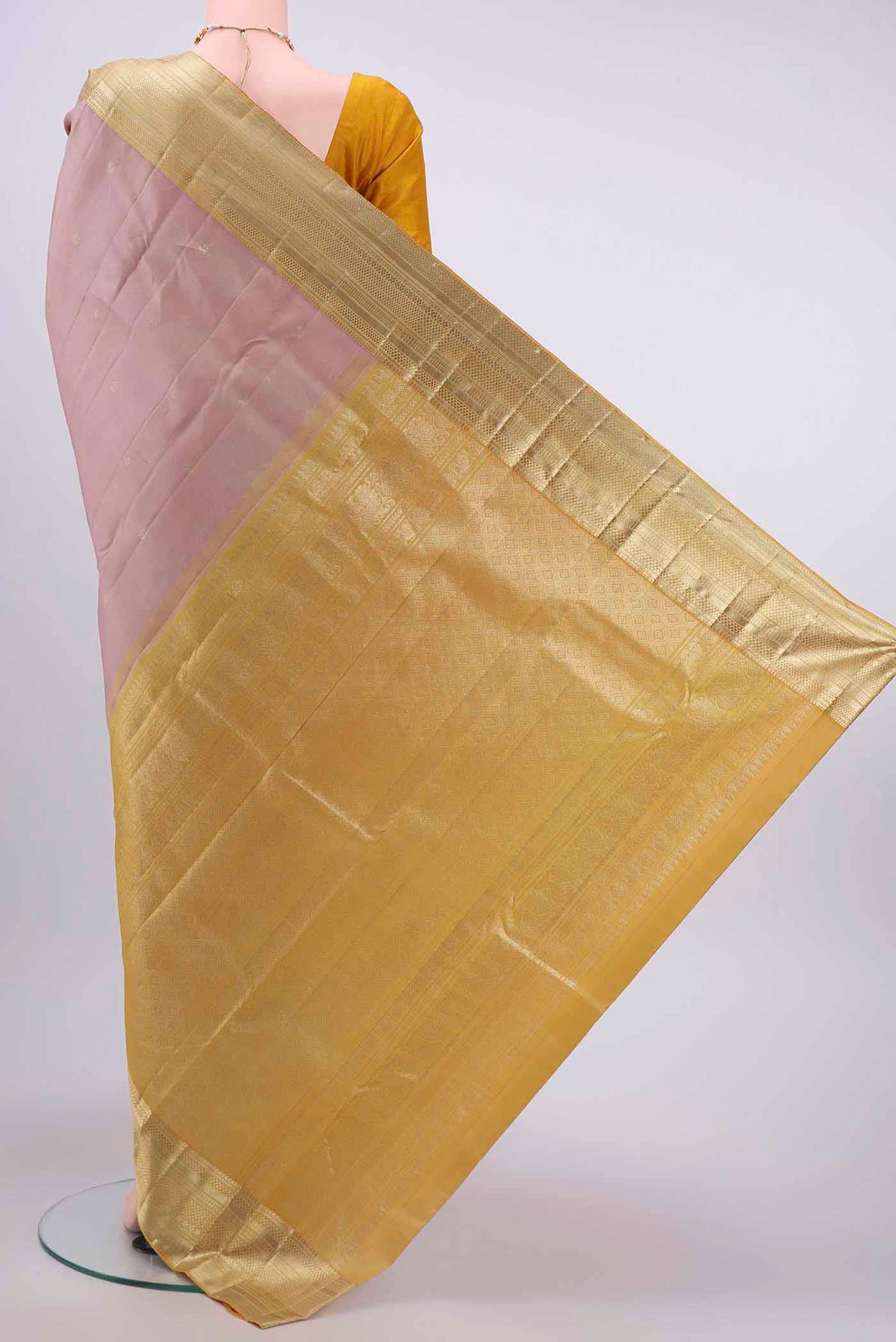 Flat view of Rose Gold Kanchipuram Saree with Zari Butta on the body and Zari Border