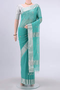 Turquoise Maheshwari Silk Cotton Saree with Zari Butta on the body and Zari Border displayed on a mannequin