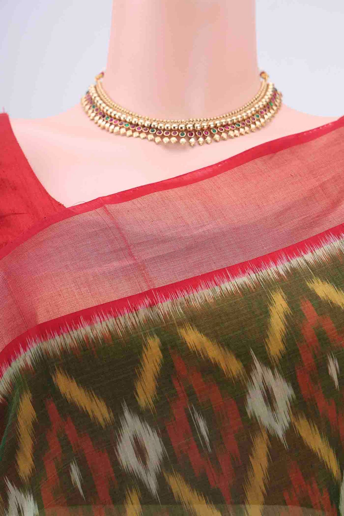Border image of Mehandi Green Kora Cotton Saree with Ikat design on the body and Zari Border