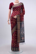 Maroon Kora Cotton Saree with Ikat design on the body and Zari Border displayed on a mannequin