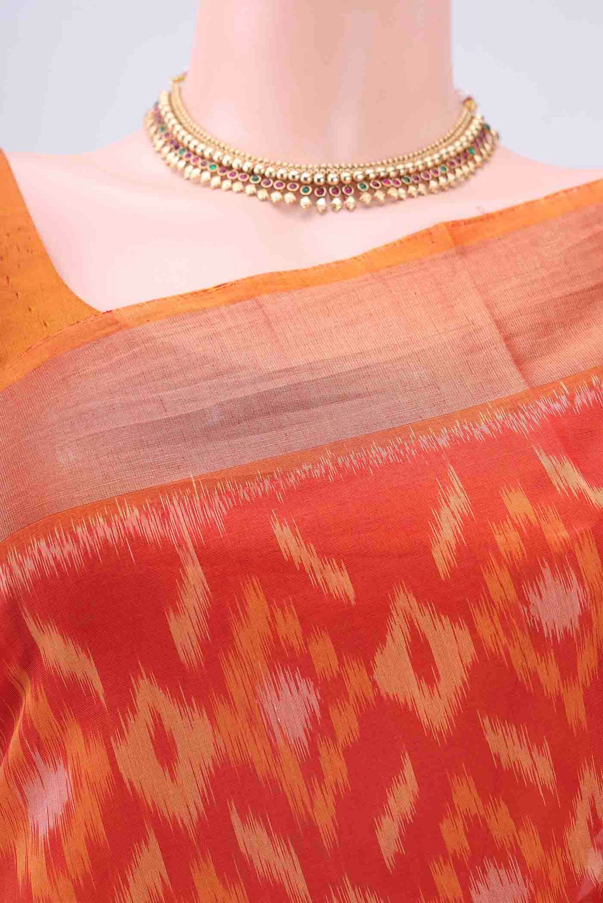 Border image of Orange Kora Cotton Saree with Ikat design on the body and Zari Border