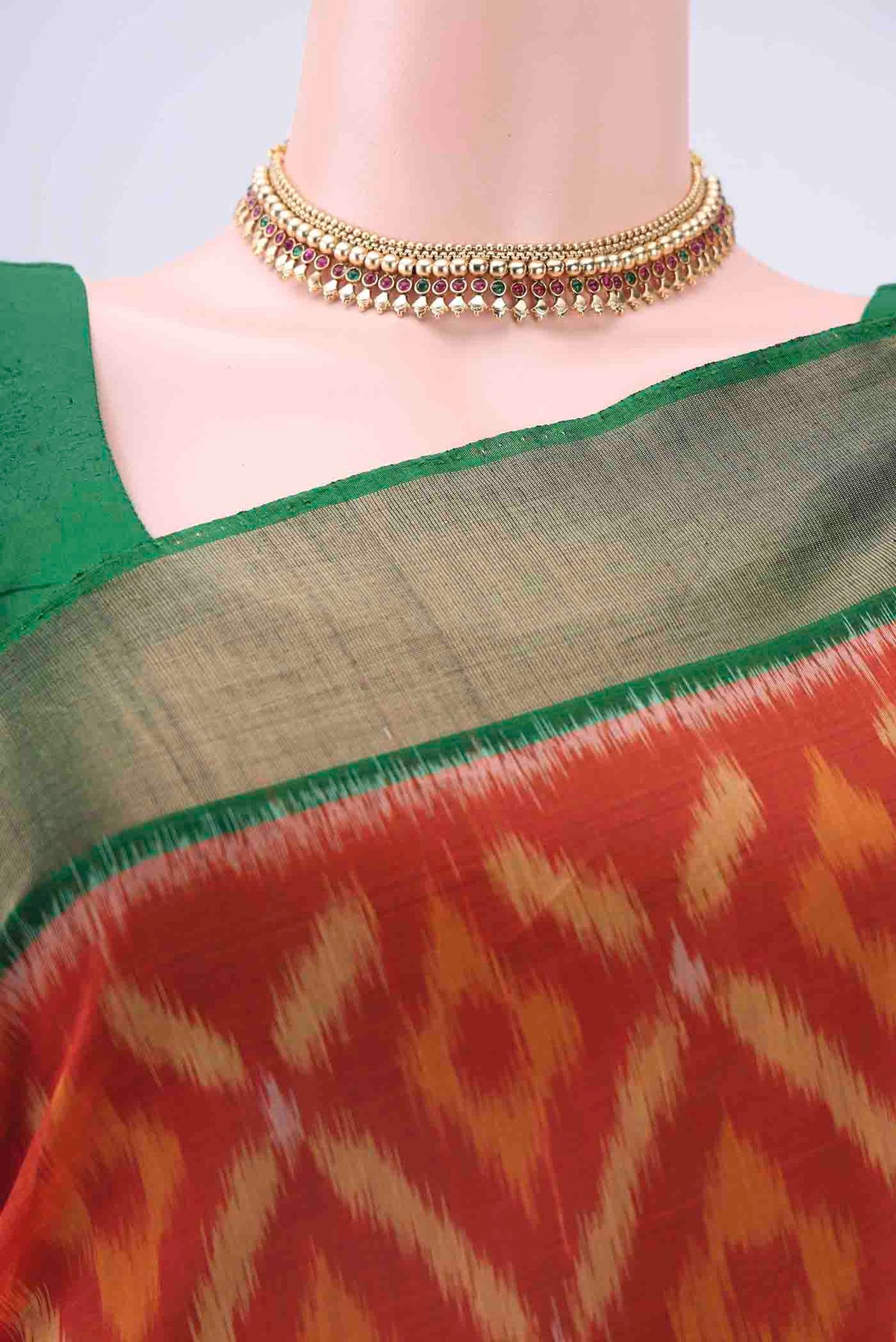 Border image of Brick Orange Kora Cotton Saree with Ikat design on the body and Zari Border