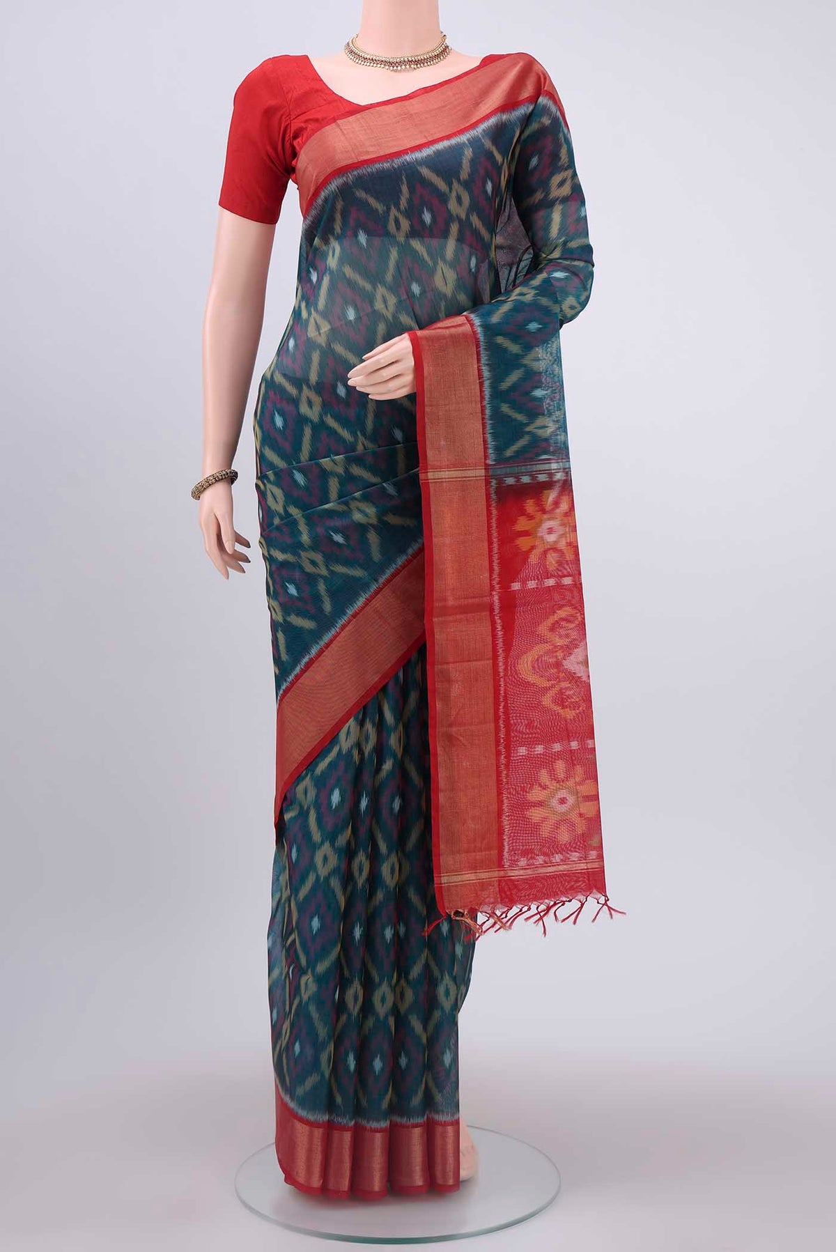 Navy Blue Silk Cotton Saree with Pure Ikat on the body and Zari Border displayed on a mannequin