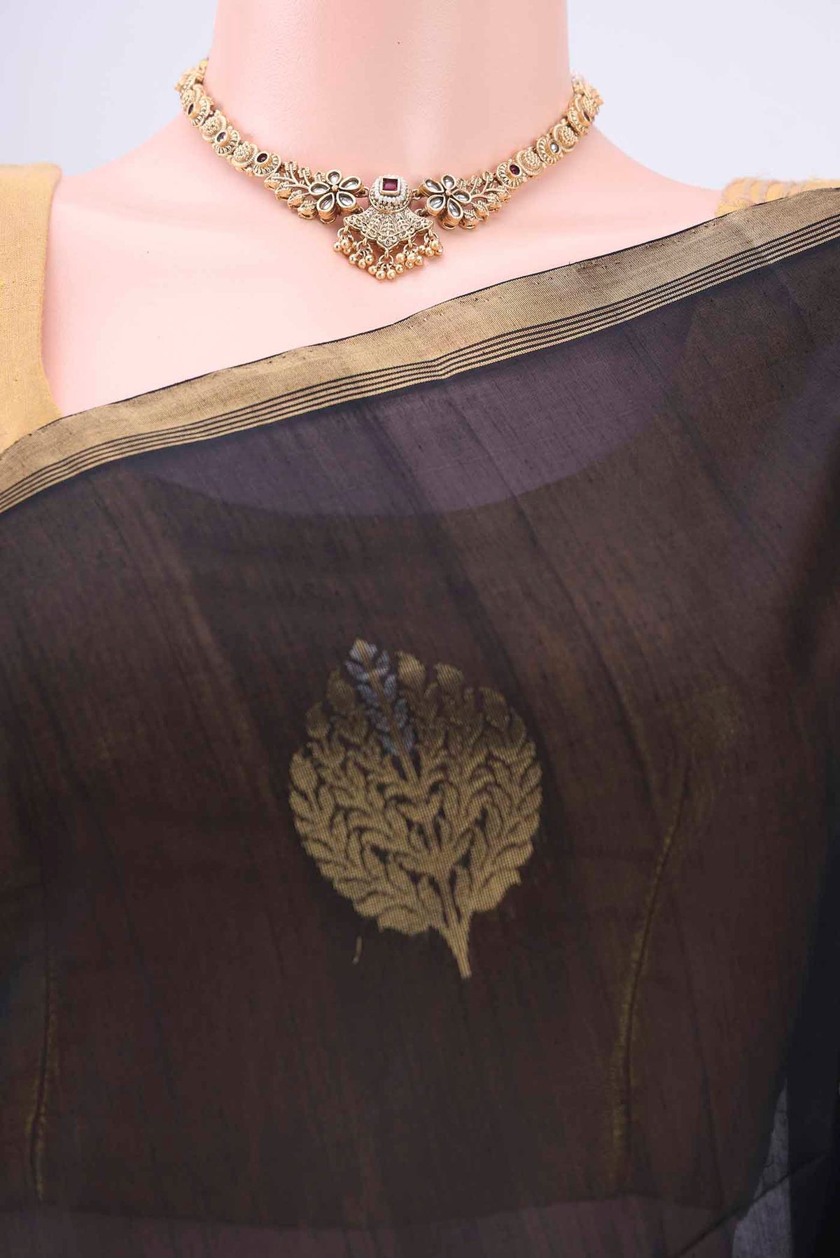 Border image of Black Kora Cotton Saree with Zari Butta on the body and Zari Border