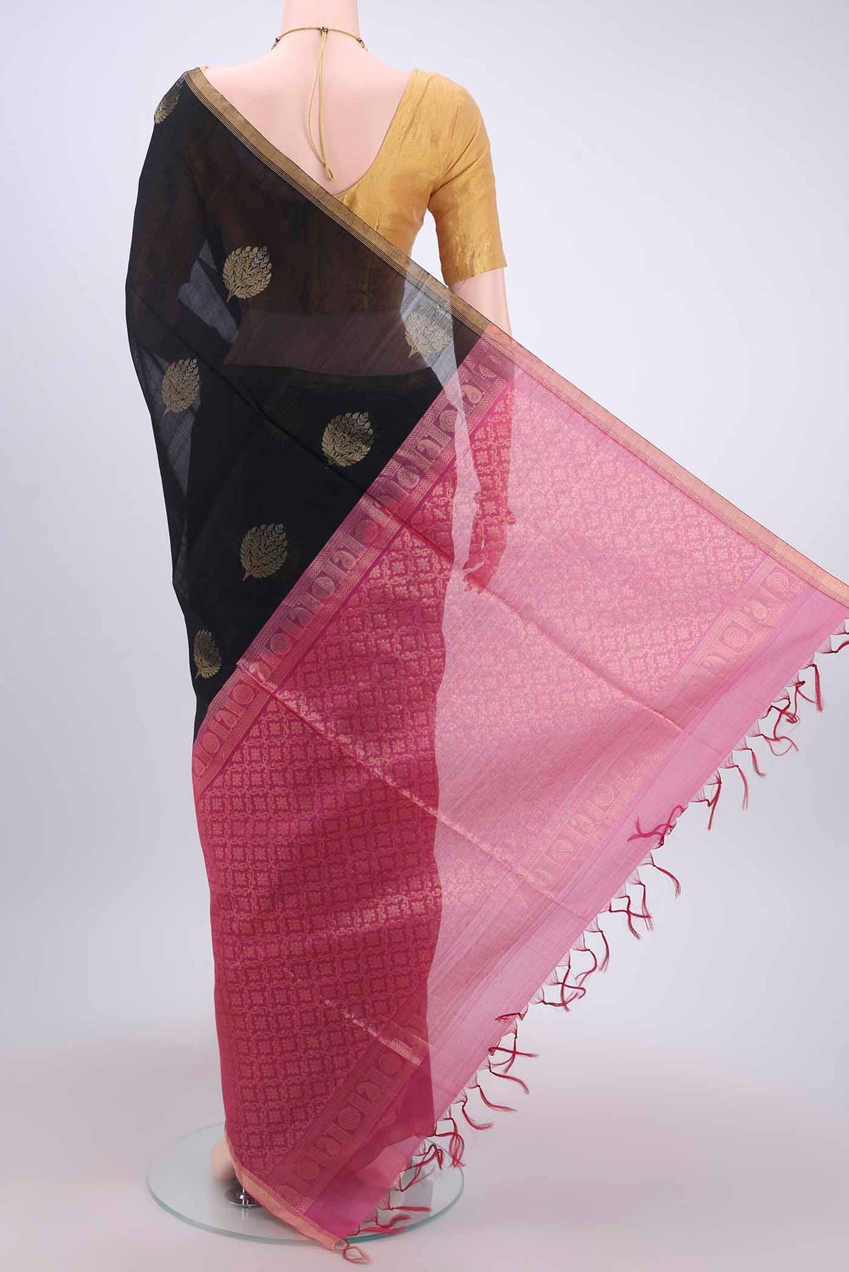 Flat view of Black Kora Cotton Saree with Zari Butta on the body and Zari Border