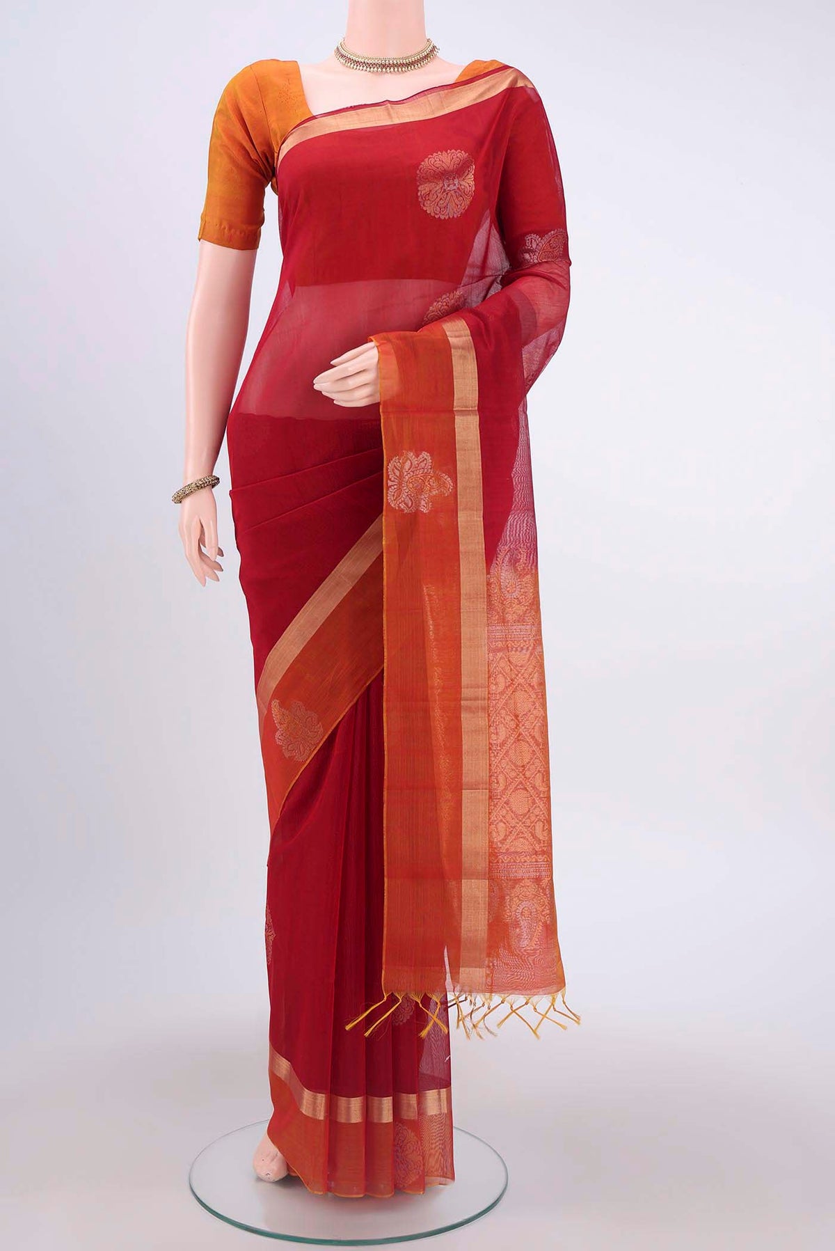 Red Silk Cotton Saree with Zari Butta on the body and Zari Border displayed on a mannequin