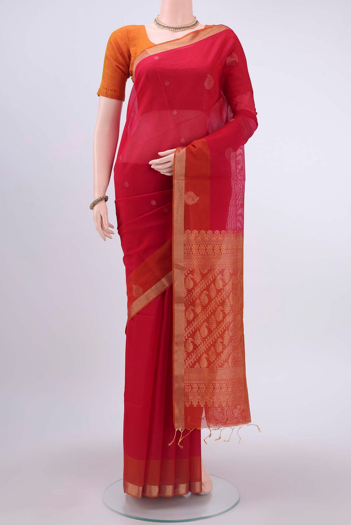 Red Kora Cotton Saree with Zari Butta on the body and Zari Border displayed on a mannequin