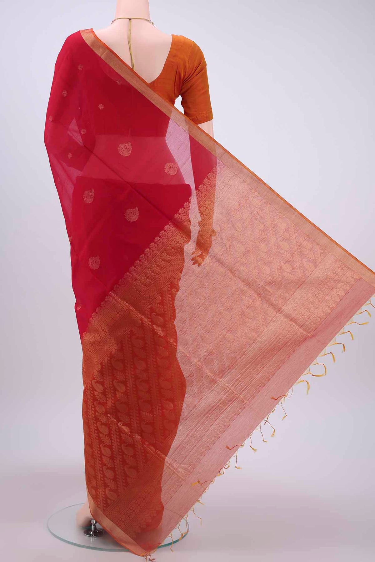 Flat view of Red Kora Cotton Saree with Zari Butta on the body and Zari Border