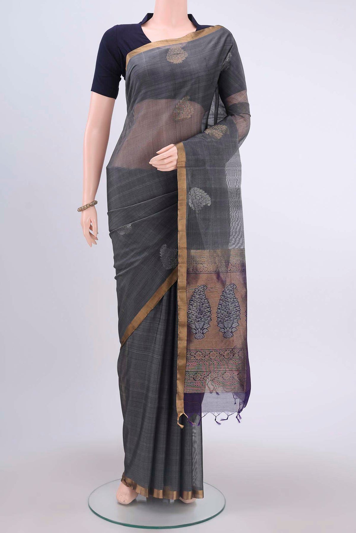 Grey Kora Cotton Saree with Zari Butta on the body and Zari Border displayed on a mannequin