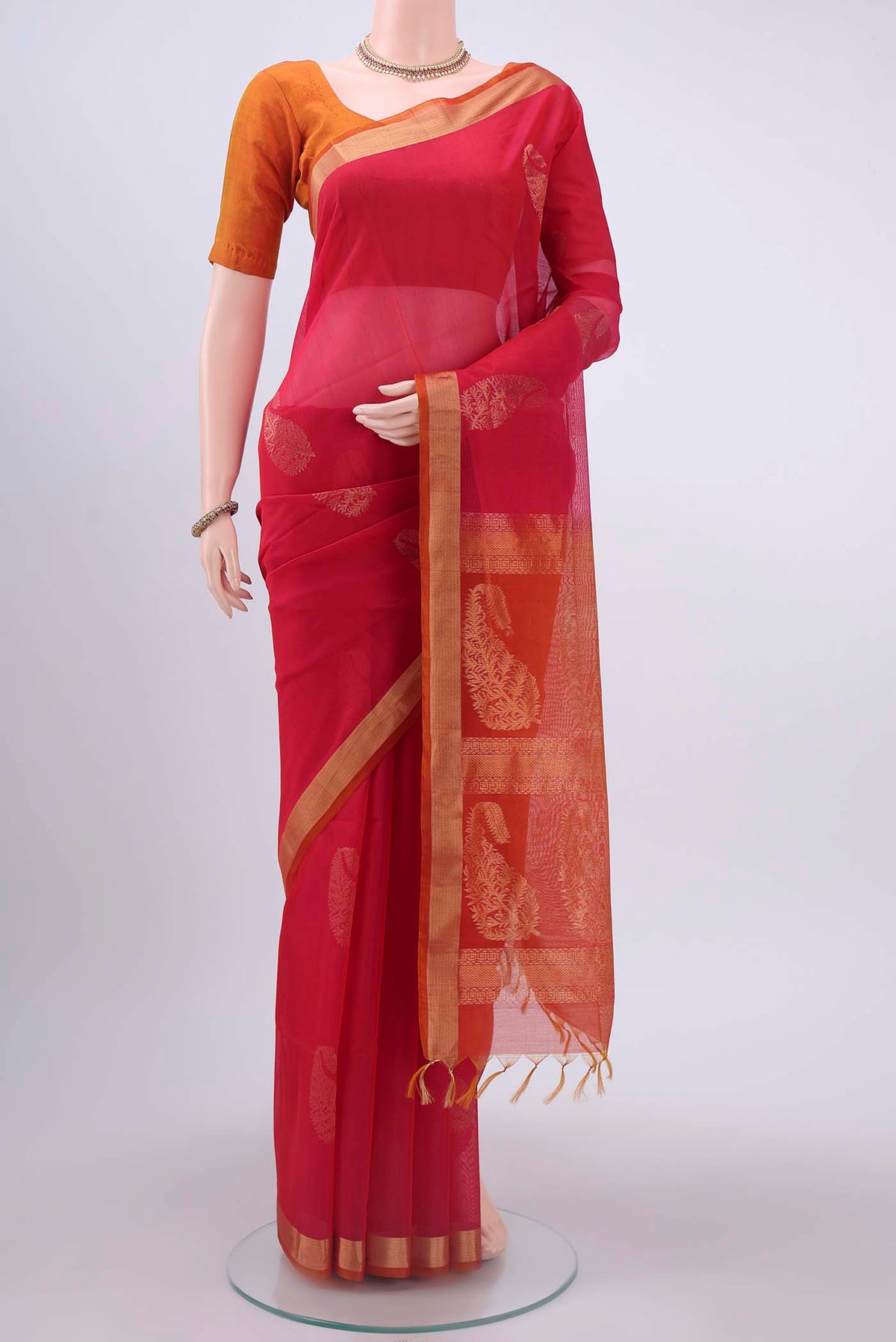 Rani Pink Kora Cotton Saree with Zari Butta on the body and Zari Border displayed on a mannequin