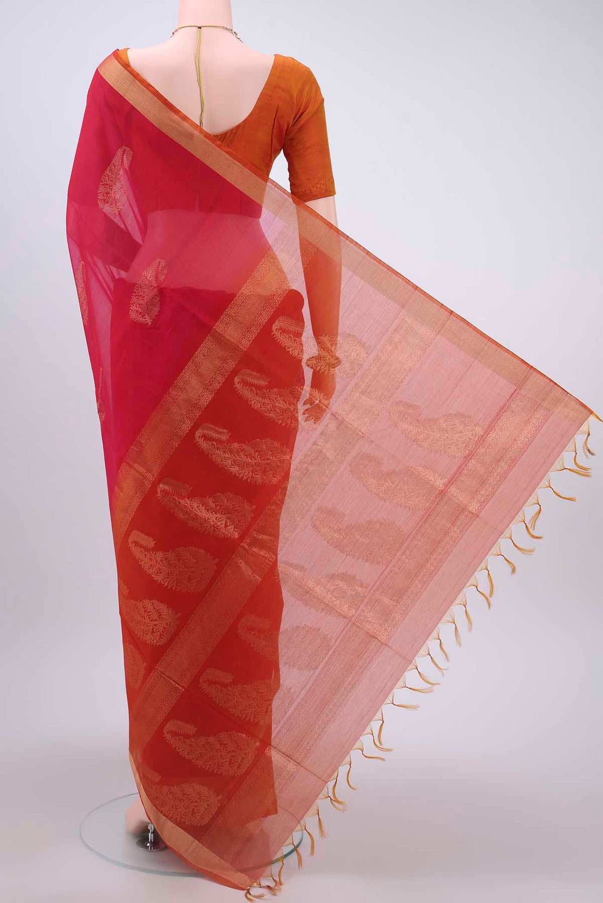 Flat view of Rani Pink Kora Cotton Saree with Zari Butta on the body and Zari Border
