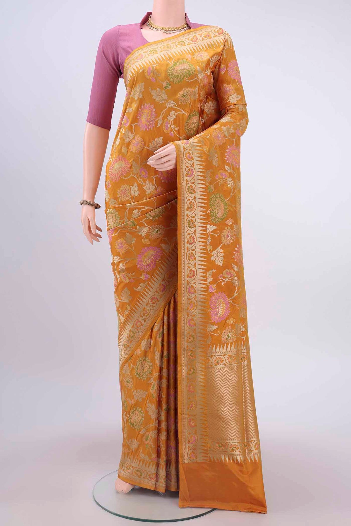 Mustard Banarasi Silk Saree with Zari Brocade on the body and Zari Border displayed on a mannequin